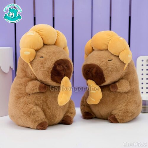 Gấu Bông Capybara Đội Bánh Sừng Bò